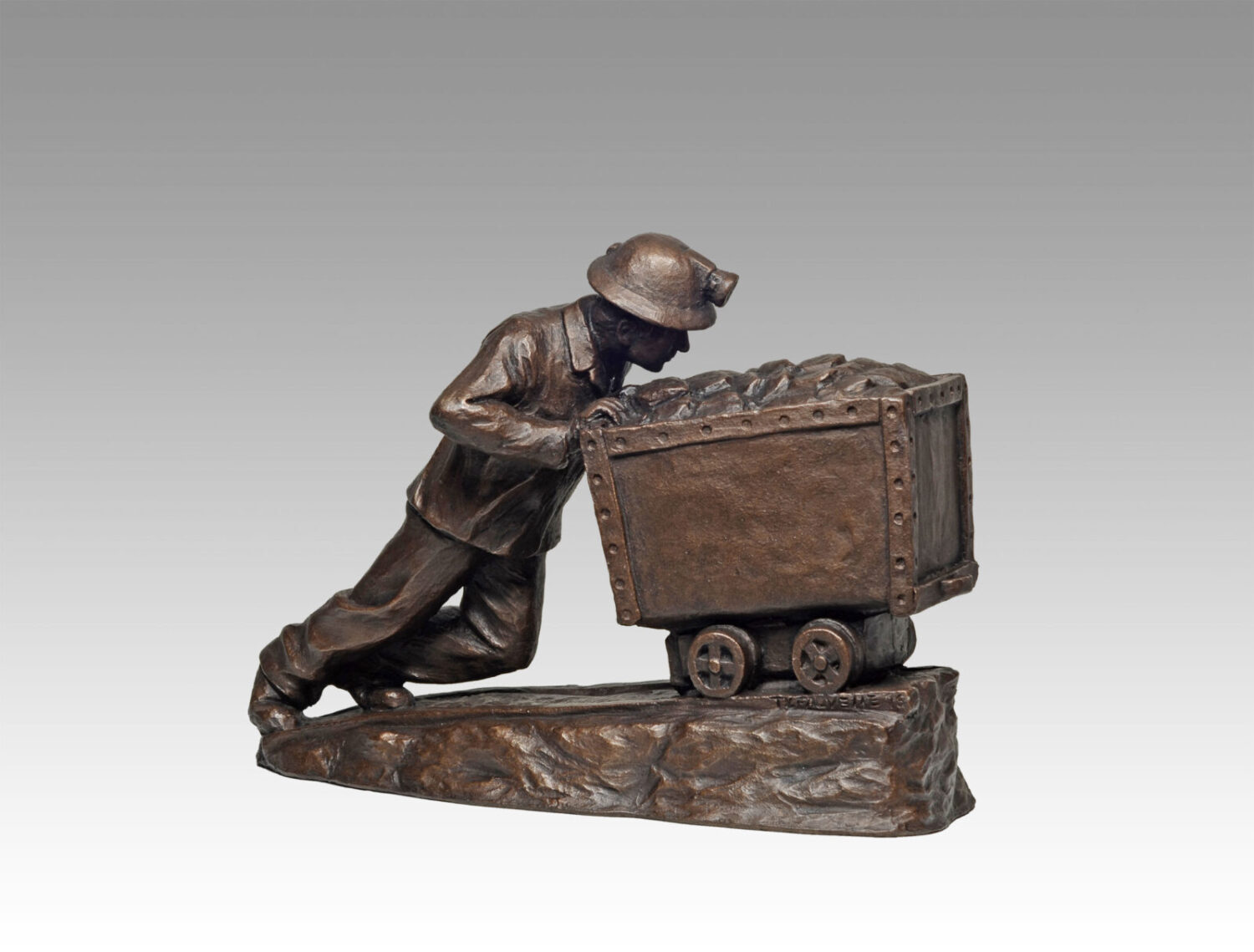 Gallery, Cartin Ore, $325 CAD, Metal Infused, 13 ¾” L x 9 ¼" H, Edition 80, Mining Sculpture of a miner pushing an ore cart, Sculptor Tyler Fauvelle