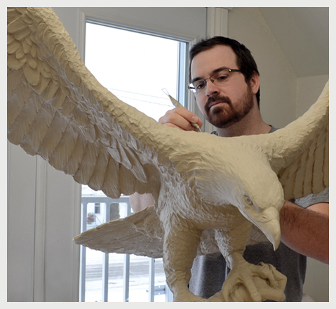 Bio, Sculptor Tyler Fauvelle sculpting eagle for Francis Pegahmagabow Monument