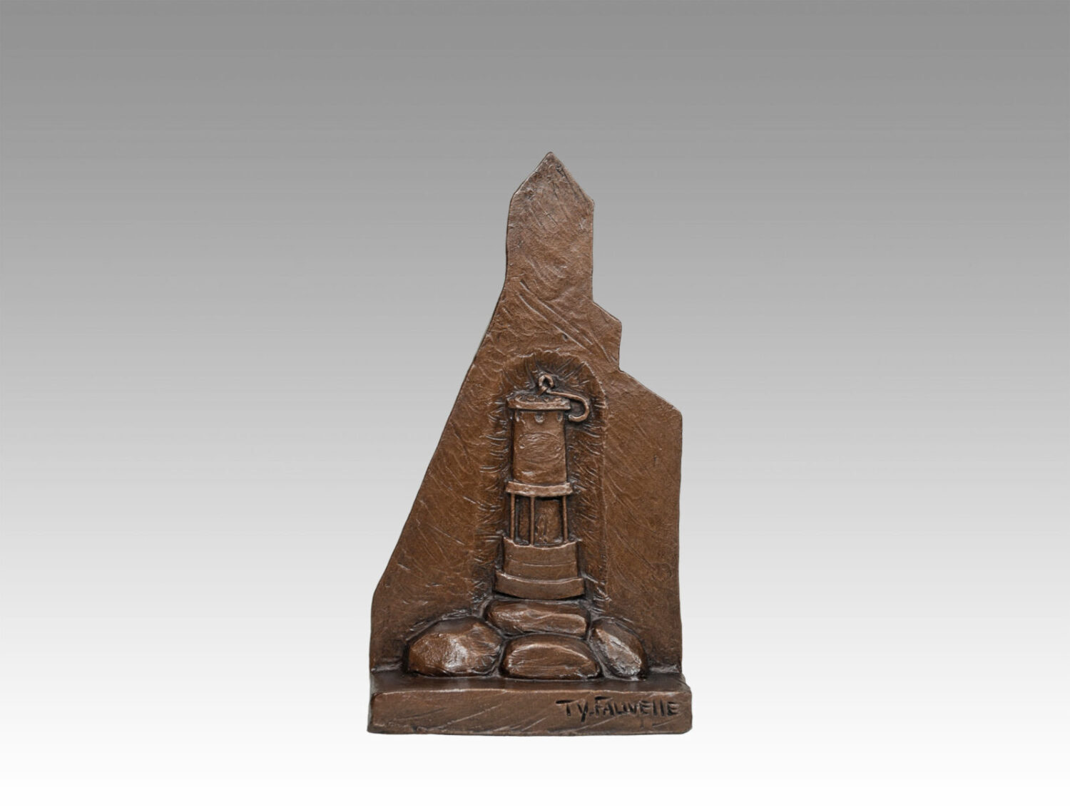 Gallery, Frame of Mine, $225 CAD, Metal Infused, 10 ½” H, Edition 80, Mining Sculpture of a Headframe with a sculptural relief of a miner's light and rock on the back, Sculptor Tyler Fauvelle