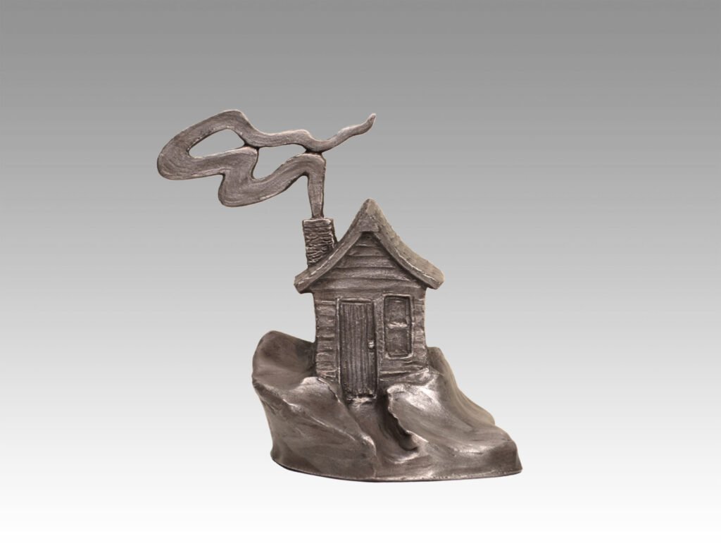 Gallery, Snowed In (Tales from Tranquil Lake Series), $200 CAD, Metal Infused, Moonlit Ore Finish, 7 ½” H, Edition 60, Land and Folk Sculpture of a house with smoke puffing out of the chimney, Sculptor Tyler Fauvelle