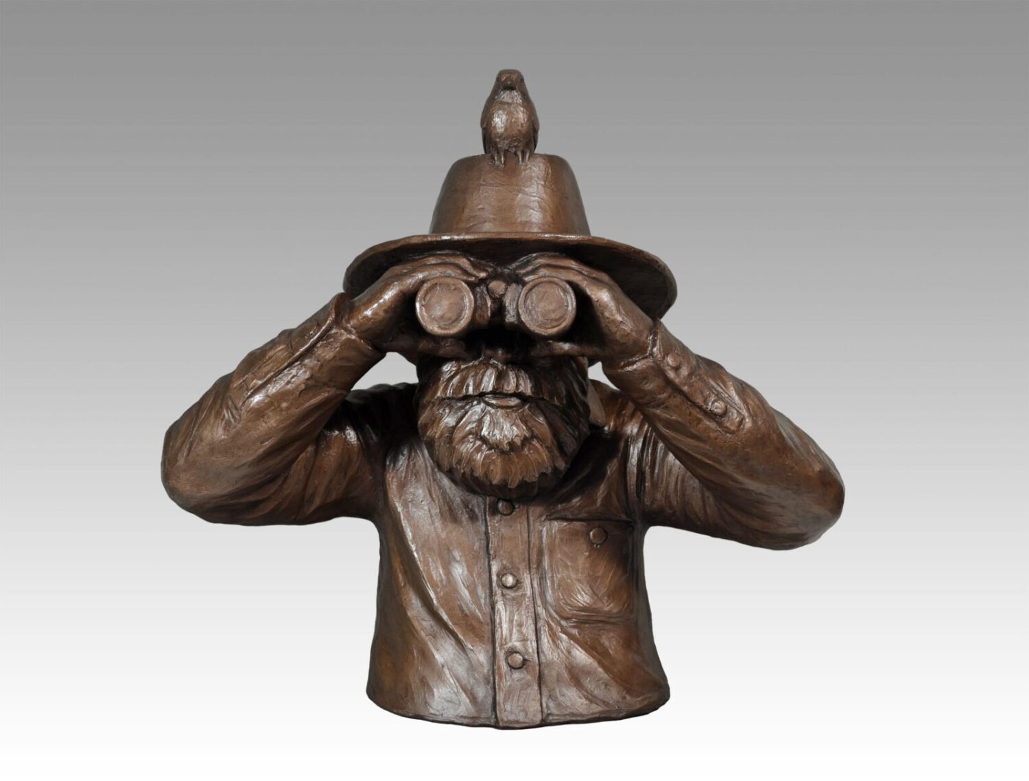 Gallery, A Big Year, $1,500 CAD, Metal Infused (Exterior/Interior), 17 ½” H x 17 ½” W, Edition 30, Sculpture of a birder with a bird on his hat, Sculptor Tyler Fauvelle